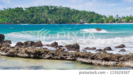 Tropical ocean lagoon, coral reef and sky. Wide photo. 115029387