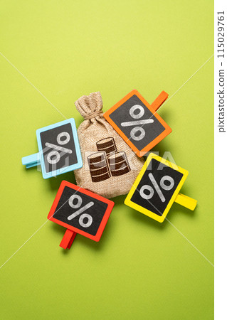 High debts and deductions. High tax burden. Money bag and a lot of interest attached. The highest interest rate on the deposit. Personal finance, taxation policy, and investment strategies. High debts and deductions. High tax burden. Money bag and a lot of interest attached. The highest interest rate on the deposit. Personal finance, taxation policy, and investment strategies. 115029761