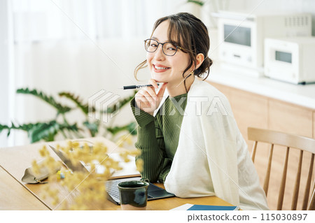 Woman doing telework at home Woman doing telework at home 115030897