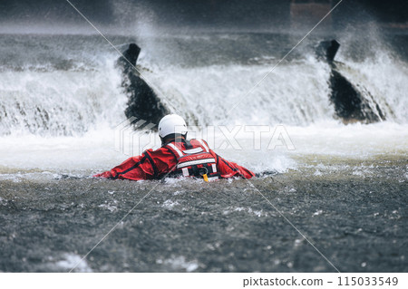Firefighter during a drowning rescue training. 115033549