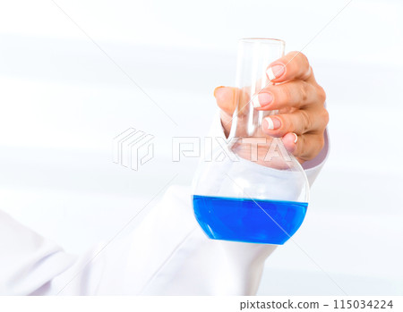 Doctor's hands with flask Doctor's hands with flask 115034224