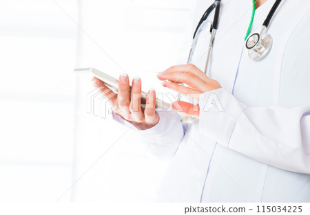 Doctor's hands with mobile phone 115034225