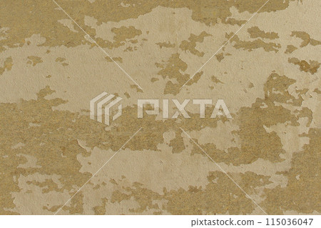 Retro vintage old peeling mustard color paint abstract pattern wall texture background 115036047