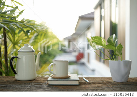 white enamel teapot and white ceramic cup white enamel teapot and white ceramic cup 115036418