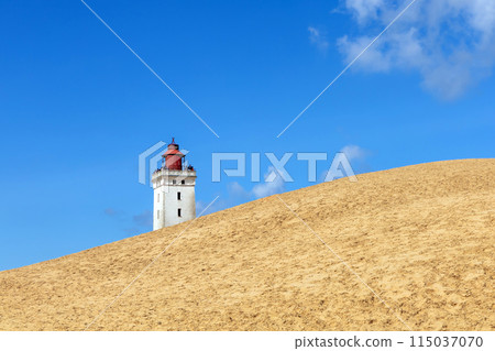 Rubjerg Knude Lighthouse on the coast of the North Sea in the Jutland in northern Denmark. Rubjerg Knude Lighthouse on the coast of the North Sea in the Jutland in northern Denmark. 115037070