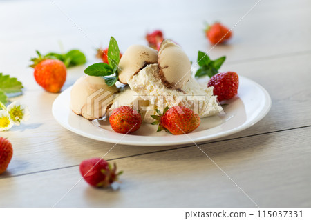 fresh organic cottage cheese with strawberries and ice cream in a plate on a wooden table 115037331