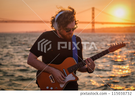 Street musician playing electric guitar in the street Street musician playing electric guitar in the street 115038732