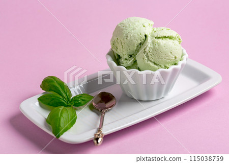 Homemade ice cream (sundae) with basil. Homemade ice cream (sundae) with basil. 115038759