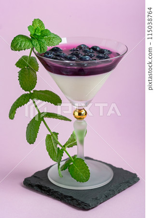 Panna cotta dessert with berry and cream layers. Panna cotta dessert with berry and cream layers. 115038764