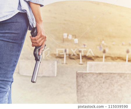 Gun in the hands of a girl, close-up arms. Gun in the hands of a girl, close-up arms. 115039590
