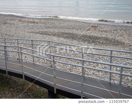 Staircase with railings on the seashore. Autumn sea. Depressive mood. 115039767