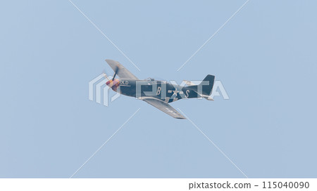 A circling American P-51D Mustang fighter plane 115040090