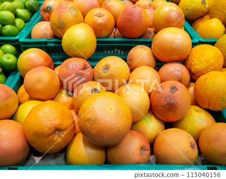Store shelves. Grapefruit counter.Ingredient for juice. Assortment in the supermarket. 115040156