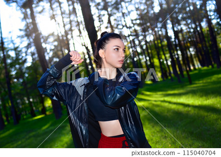 Fitness woman exercising in the park in early spring on fresh air. 115040704