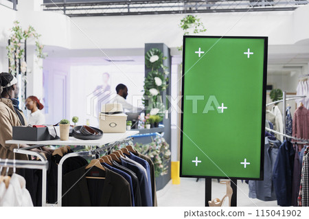 Empty green screen mock up advertising shoes new collection in fashion boutique. Blank chroma key interactive display for promotion and stiletto showcasing for clients in mall 115041902