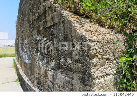 War relics preserved in Kasai City, Hyogo Prefecture: A close-up of the wall of a huge air-raid shelter (former self-powered power plant) in a corner of a field 115042440