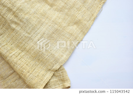 torn sackcloth isolated on white background, burlap fabric texture for design 115043542