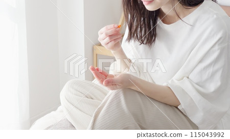 Woman taking medicine Woman taking medicine 115043992