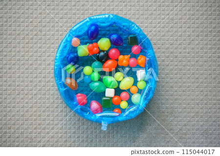 I filled a plastic pool with water and super balls so that I could play super ball scooping at home with my kids. 115044017