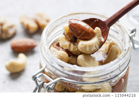 Nuts pickled in honey Nuts pickled in honey 115044218