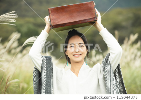 A woman traveling on a plateau A woman traveling on a plateau 115044373