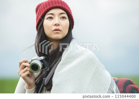 A woman taking a picture 115044400