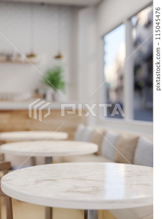 A space for displaying products on a luxury white marble round table in a contemporary coffee shop. A space for displaying products on a luxury white marble round table in a contemporary coffee shop. 115045476