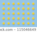 Seamless repetitive yellow pills arrangement on soft blue background. 115046649