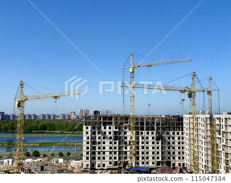 Construction site with cranes and buildings symbolizes urban development and progress in city Construction site with cranes and buildings symbolizes urban development and progress in city 115047384