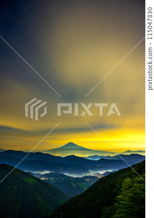 Mount Fuji floating in the colorful night sky and city lights Mount Fuji floating in the colorful night sky and city lights 115047830