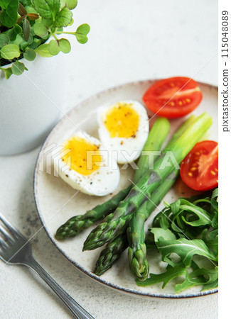 Fresh Spring Salad With Boiled Eggs, Asparagus, and Tomatoes on a Bright Day Fresh Spring Salad With Boiled Eggs, Asparagus, and Tomatoes on a Bright Day 115048089