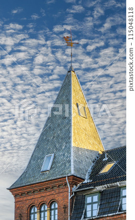 Golden Spire Against a Cloudy Sky 115048118