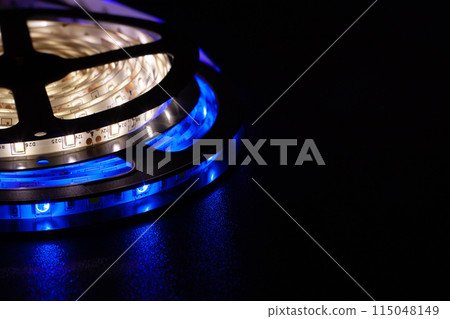 LED strip with blue and warm white SMD LEDs, with a black background LED strip with blue and warm white SMD LEDs, with a black background 115048149