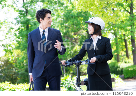 Businesswoman commuting by bicycle, office worker, man and woman, two people Businesswoman commuting by bicycle, office worker, man and woman, two people 115048250