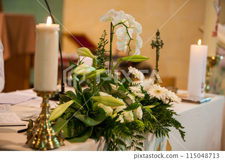 Create a classy ambiance with flowers, candles, and gentle lighting for a serene setting Create a classy ambiance with flowers, candles, and gentle lighting for a serene setting 115048713