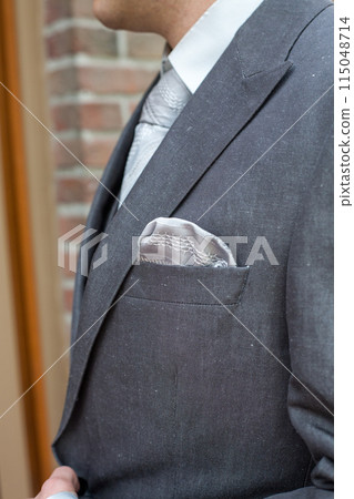 Elegant Gray Suit with Pocket Square, perfect for formal events like weddings or business meetings 115048714