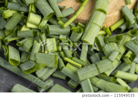 green onions on the table during cooking green onions on the table during cooking 115049535