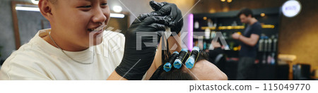 Hairdresser Putting Rollers in Wet Hair Hairdresser Putting Rollers in Wet Hair 115049770