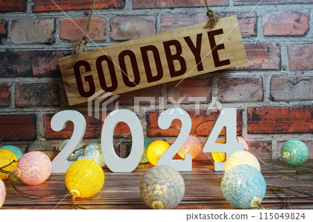 Goobye 2024 years number with LED cotton balls decoration top view on wooden background Goobye 2024 years number with LED cotton balls decoration top view on wooden background 115049824