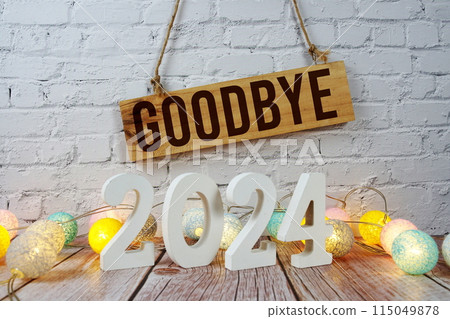 Goodbye 2024 years number with LED cotton balls decoration on wooden background Goodbye 2024 years number with LED cotton balls decoration on wooden background 115049878