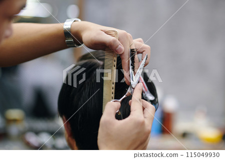 Barber Cutting Hair Back 115049930