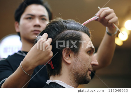 Barber Taking off Hair Clips 115049933