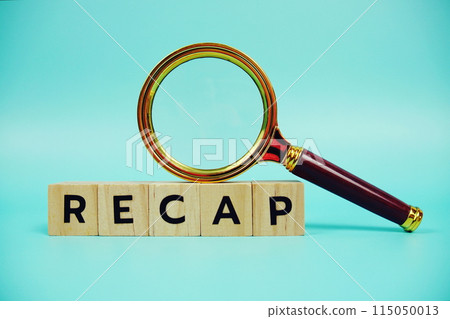 Recap with wooden blocks alphabet letters and Magnifying glass on blue background 115050013