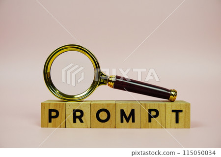 Prompt with wooden blocks alphabet letters and Magnifying glass on pink background 115050034