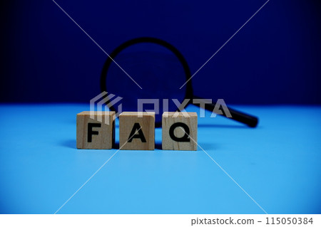 FAQ with wooden blocks alphabet letters and Magnifying glass on blue background FAQ with wooden blocks alphabet letters and Magnifying glass on blue background 115050384