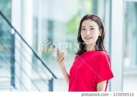 Business person who operates a smartphone Business person who operates a smartphone 115050513
