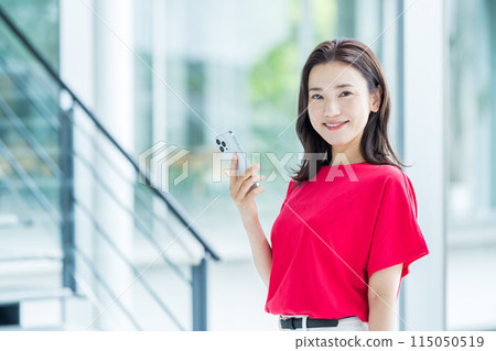 Business person who operates a smartphone Business person who operates a smartphone 115050519