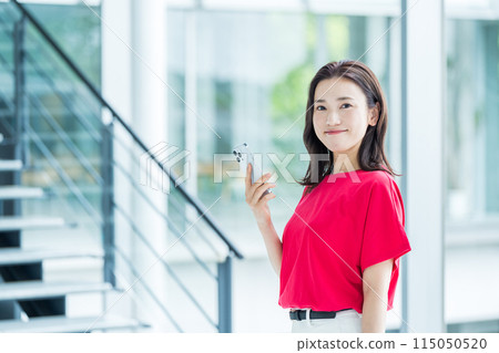 Business person who operates a smartphone Business person who operates a smartphone 115050520