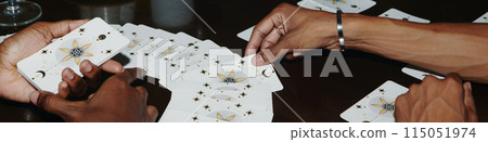 Web banner with hands of people doing tarot spread 115051974