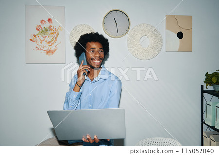 Black Entrepreneur Talking on Phone Black Entrepreneur Talking on Phone 115052040